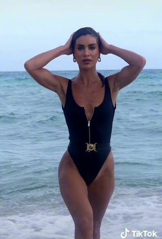 6. Sexy Camila Coelho Shows Cleavage in Black Swimsuit in the Sea