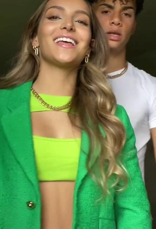 6. Beautiful Corinne Pino Shows Cleavage in Sexy Green Crop Top