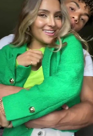 4. Sweetie Corinne Pino Shows Cleavage in Green Crop Top