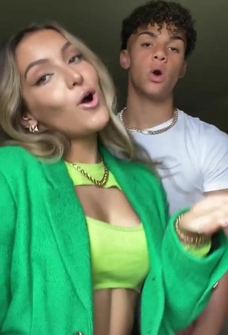 5. Sweetie Corinne Pino Shows Cleavage in Green Crop Top