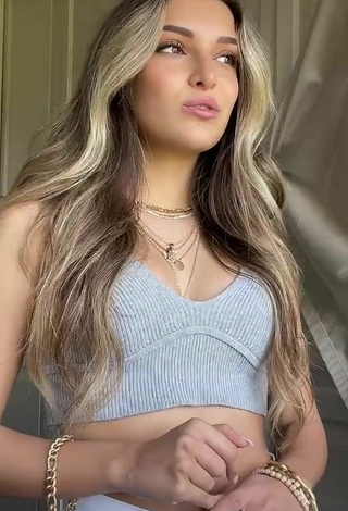 5. Hot Corinne Pino Shows Cleavage in Grey Crop Top