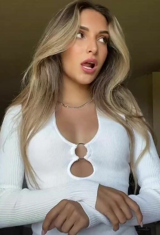 5. Beautiful Corinne Pino Shows Cleavage in Sexy White Dress