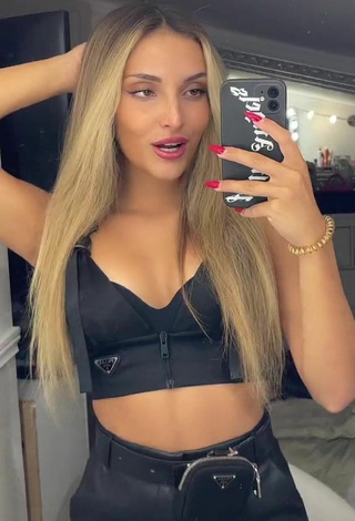 4. Sexy Corinne Pino Shows Cleavage in Black Crop Top