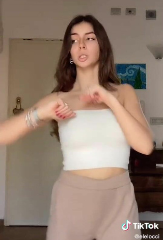 4. Sexy Eleonora Shows Cleavage in White Tube Top