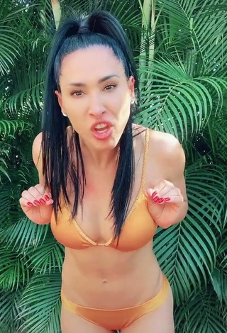 4. Sexy Jaqueline Shows Cleavage in Orange Bikini