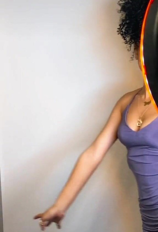 Erotic Lanii Kay Shows Cleavage in Purple Dress