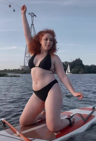3. Beautiful Elizaveta Strizh Shows Cleavage in Sexy Black Bikini in the Sea