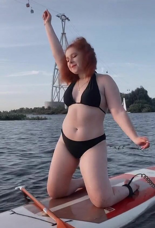 4. Beautiful Elizaveta Strizh Shows Cleavage in Sexy Black Bikini in the Sea