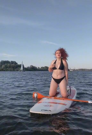 Hot Elizaveta Strizh Shows Cleavage in Black Bikini in the Sea