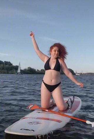 3. Hot Elizaveta Strizh Shows Cleavage in Black Bikini in the Sea
