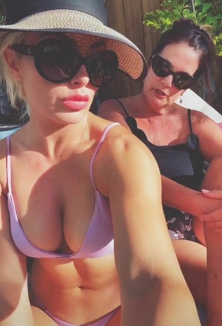 1. Erotic Mandy Rose Shows Cleavage in Purple Bikini
