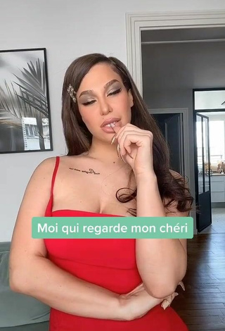 2. Hot Océane Shows Cleavage in Red Dress