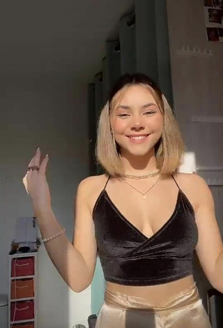 Seductive Romane Bertrand Shows Cleavage in Black Crop Top
