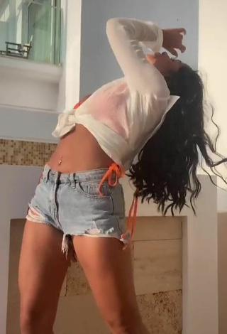 3. Hot Sabrine Khan Shows Cleavage in Orange Bikini Top