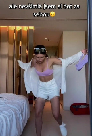 2. Sexy Anna Šulcová Shows Cleavage in Purple Bikini Top