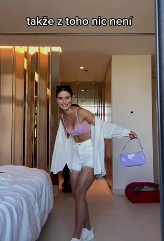 4. Sexy Anna Šulcová Shows Cleavage in Purple Bikini Top