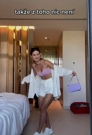 5. Sexy Anna Šulcová Shows Cleavage in Purple Bikini Top