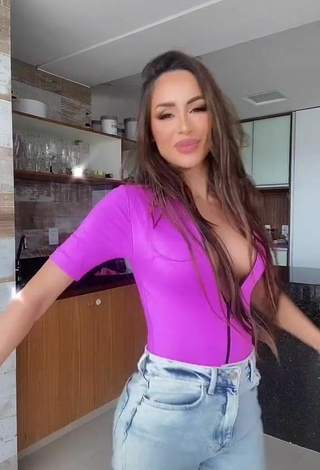 3. Beautiful Késia Muniz de Oliveira Shows Cleavage in Sexy Violet Top