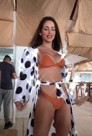 Cute Késia Muniz de Oliveira Shows Cleavage in Orange Bikini