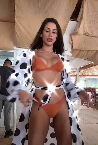 2. Cute Késia Muniz de Oliveira Shows Cleavage in Orange Bikini