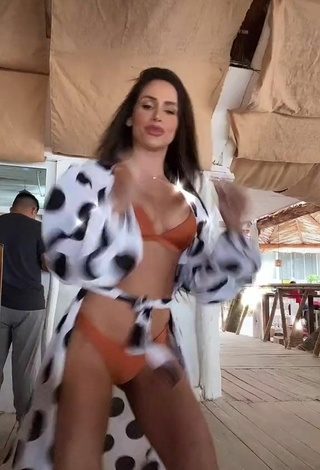4. Cute Késia Muniz de Oliveira Shows Cleavage in Orange Bikini