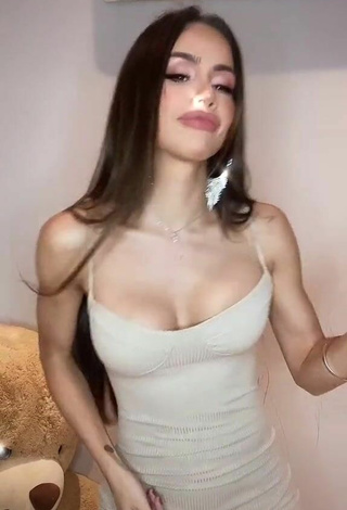 2. Sexy Késia Muniz de Oliveira Shows Cleavage in White Dress