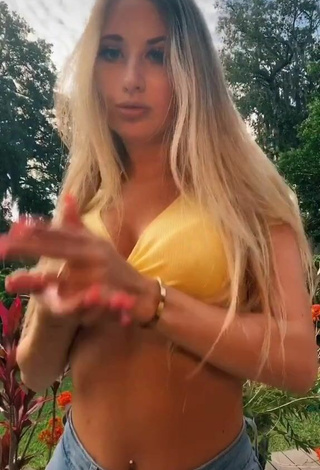 4. Pretty Ali Marie Shows Cleavage in Yellow Crop Top