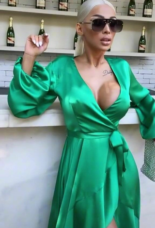 1. Hot Cristina Pucean Shows Cleavage in Green Dress