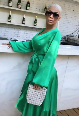 3. Hot Cristina Pucean Shows Cleavage in Green Dress