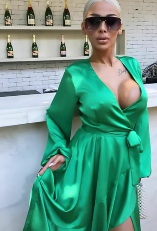 4. Hot Cristina Pucean Shows Cleavage in Green Dress