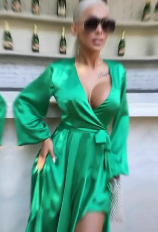 6. Hot Cristina Pucean Shows Cleavage in Green Dress