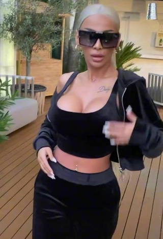 6. Sexy Cristina Pucean Shows Cleavage in Black Crop Top