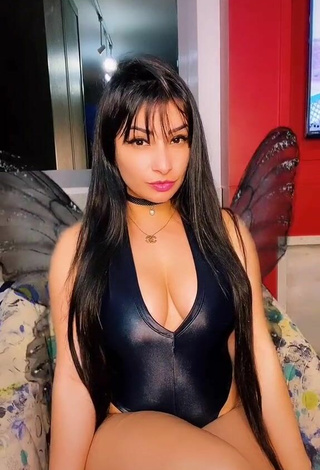 Sweetie Emanuelly Raquel Shows Cleavage in Black Bodysuit