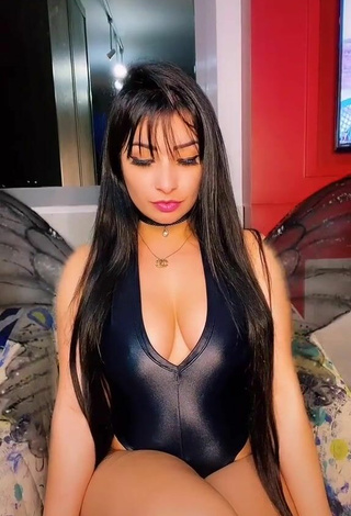 3. Sweetie Emanuelly Raquel Shows Cleavage in Black Bodysuit