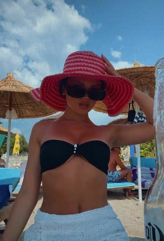 2. Hot Grisela Shows Cleavage in Black Bikini Top at the Beach