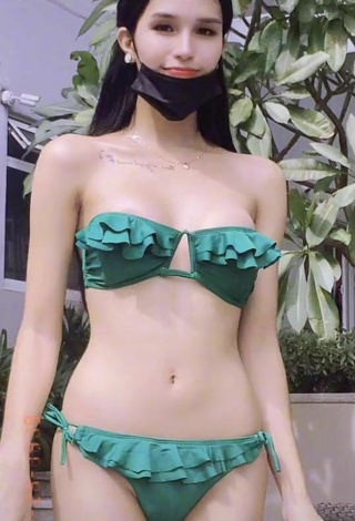 2. Sexy Jing Alvarez Shows Cleavage in Green Bikini