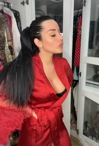 Sexy Laura Lempika Shows Cleavage in Red Bathrobe