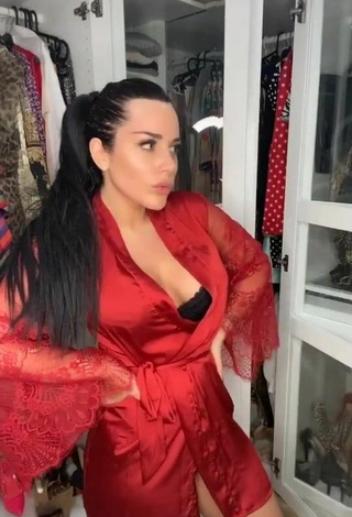 2. Sexy Laura Lempika Shows Cleavage in Red Bathrobe