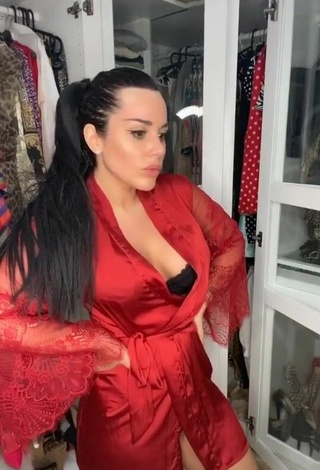 3. Sexy Laura Lempika Shows Cleavage in Red Bathrobe