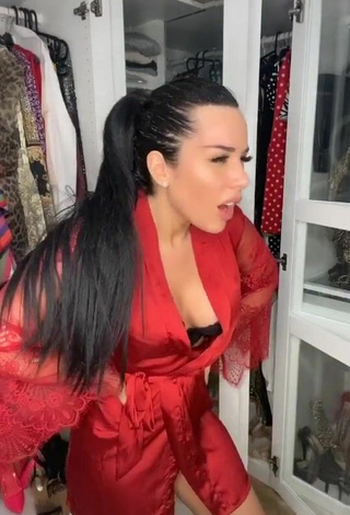 4. Sexy Laura Lempika Shows Cleavage in Red Bathrobe