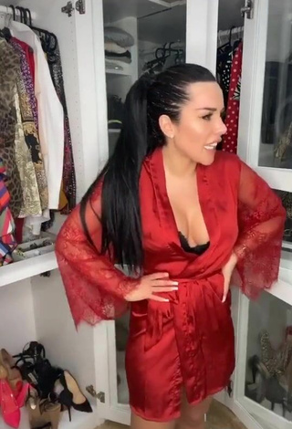 6. Sexy Laura Lempika Shows Cleavage in Red Bathrobe