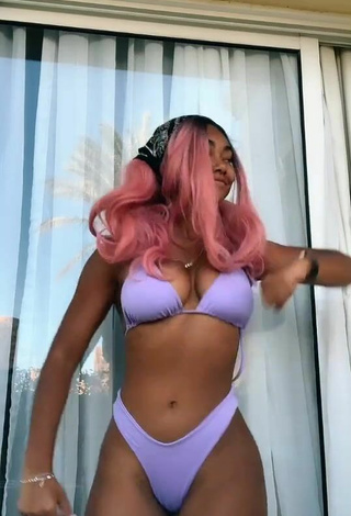 Beautiful Elizabeth Anorue Shows Cleavage in Sexy Purple Bikini
