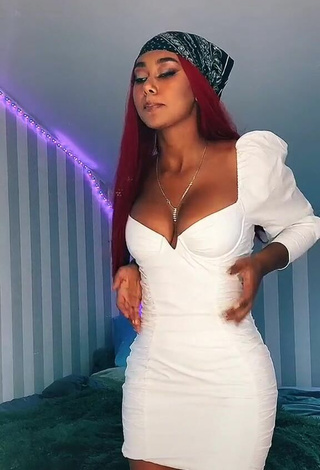 Hot Elizabeth Anorue Shows Cleavage in White Dress