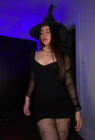 2. Sexy Naomi in Black Dress