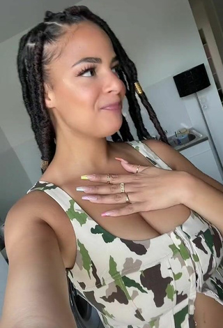 5. Sexy peachy.mely Shows Cleavage in Camouflage Crop Top