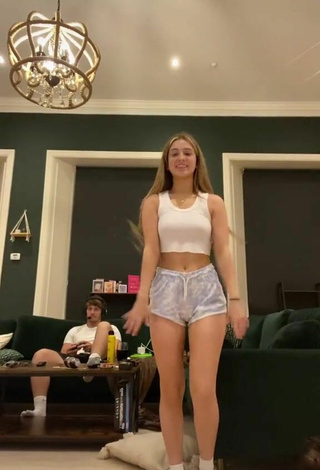 2. Sexy Poppy Mead in White Crop Top