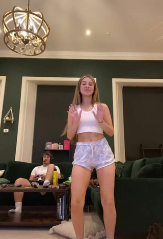 6. Sexy Poppy Mead in White Crop Top