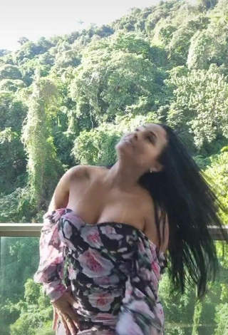 5. Sexy Renee Blimgiz Shows Cleavage in Floral Dress on the Balcony