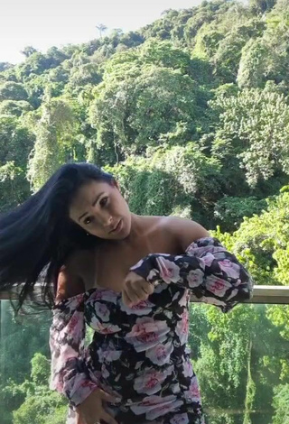 6. Sexy Renee Blimgiz Shows Cleavage in Floral Dress on the Balcony