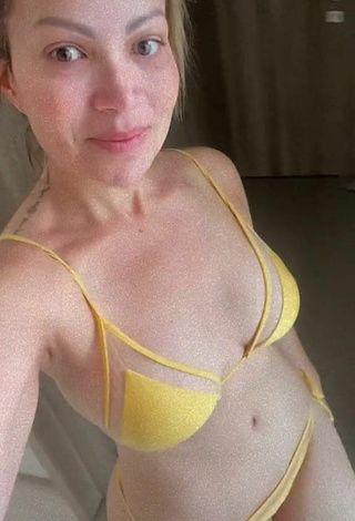 4. Hot Solange Almeida Shows Cleavage in Yellow Bikini